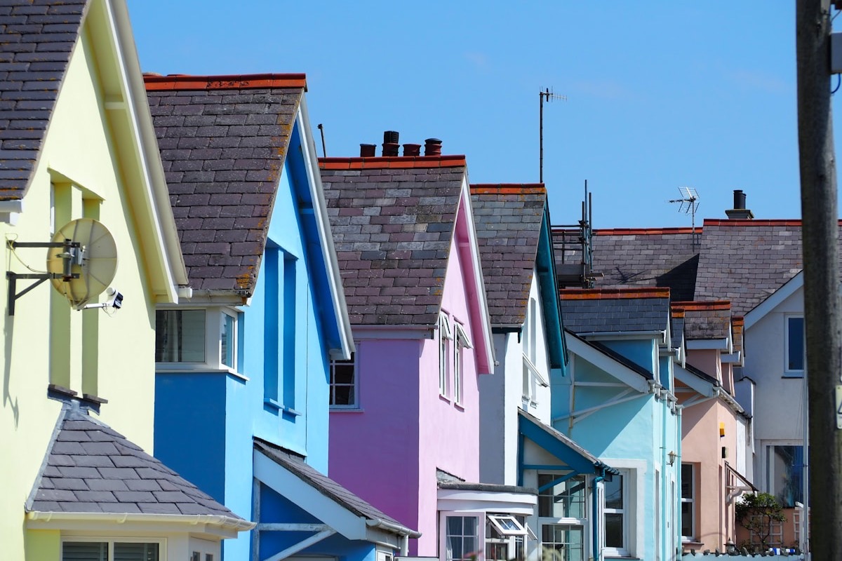 Colourful British seaside terraced houses with pitched roofs and chimneys